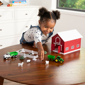 Girl playing with farm set animals