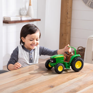 Boy playing with tough tractor