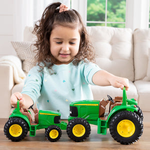Girl playing with tractors
