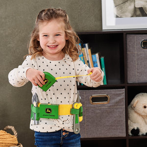 Girl playing with tape measure