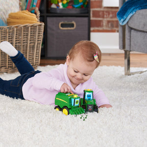 Baby playing with tractors 
