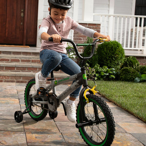 Boy riding bike with helmet on