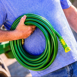 Man holding rolled up hose