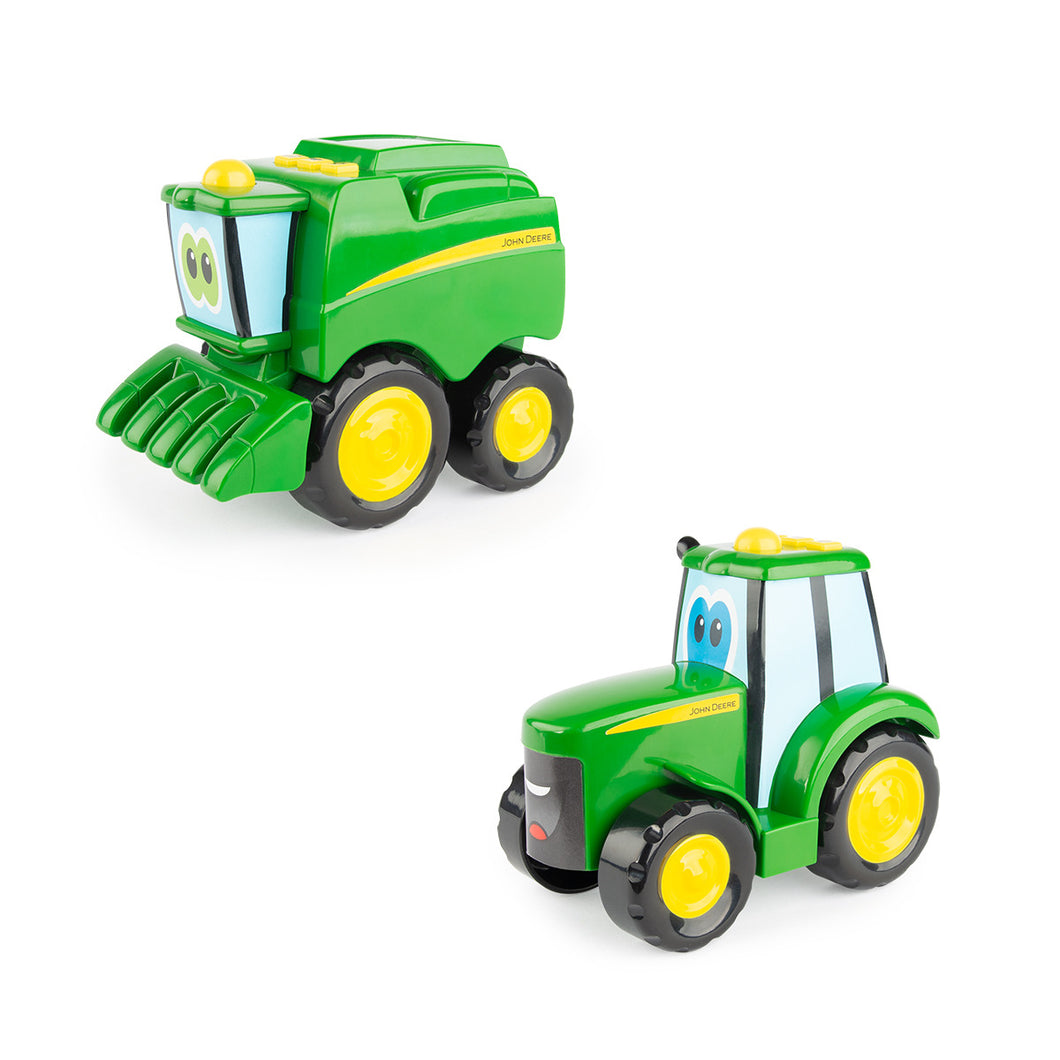 Two hard plastic tractors