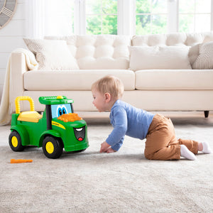 Boy crawling towards tractor